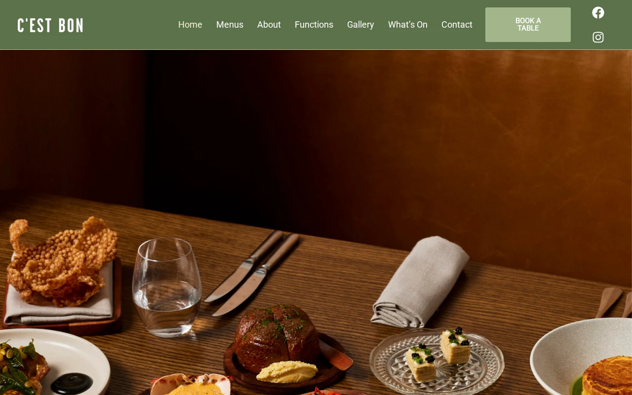 Desktop screenshot of the C'est Bon website showing French dishes and links to menus, functions and table bookings